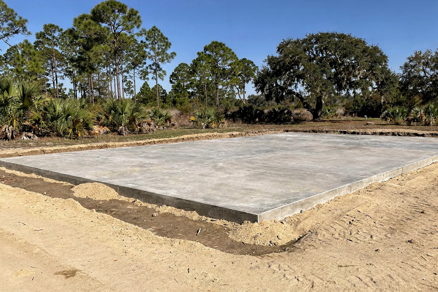 Pole barn slab on a raised compacted sand pad near Lake Wales, Polk County
